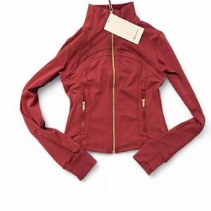 Authentic Lululemon Define jacket in a rich red shade with gold zipper